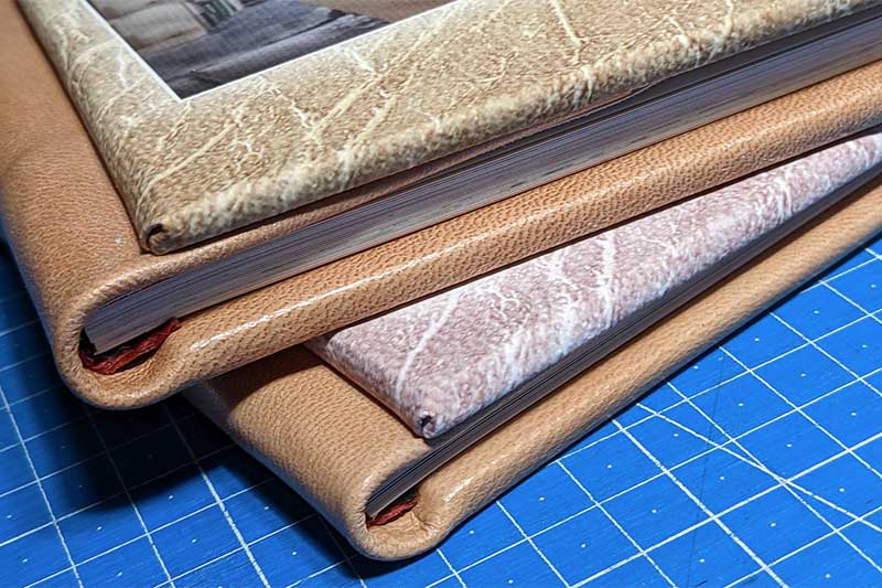 Álbumes fotográficos artesanales con cuero auténtico y páginas cosidas